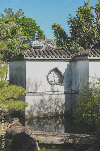 Fukushūen traditional Chinese garden in the Kume area of Naha, Okinawa Japan with pagodas and pavilions with single pond extending into most sections of the garden photo