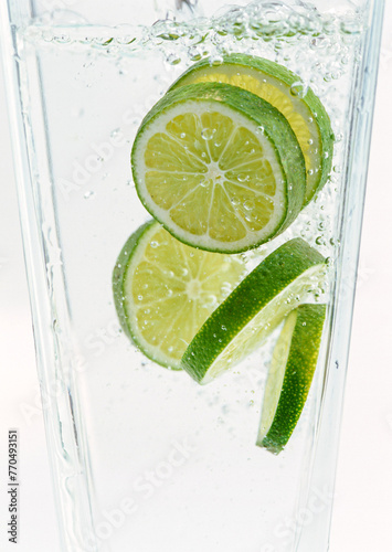 Sliced limes in clear water