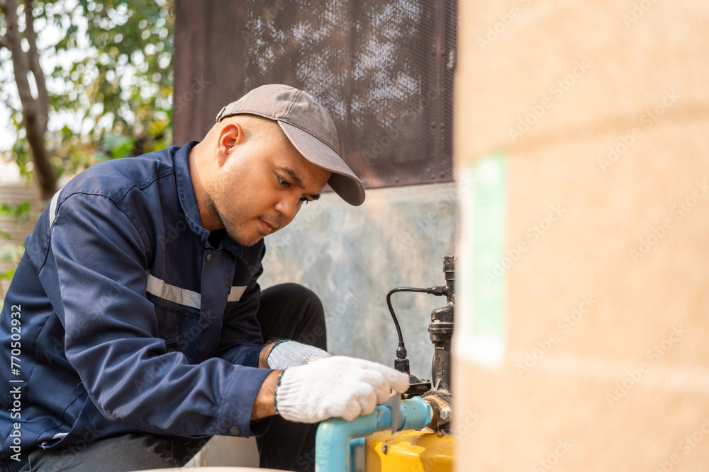 Male Plumber worker installation pipe system hand holding the water tap faucet. Plumbing checking service and repair. Male Plumber worker installation pipe system hand holding the water tap faucet. Plumbing checking service and repair.