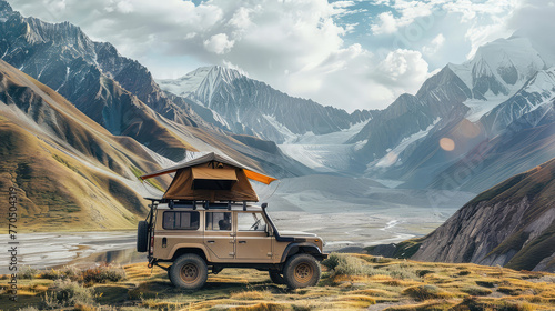 The SUV with a roof awning stands against the backdrop of a majestic mountain landscape, embodying the spirit of travel. Offroad travel