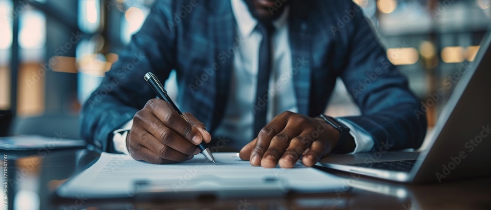 Businessman engaging with laptop and esigning on tablet, virtual notepad technology