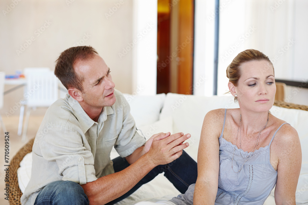 Divorce, couple and conversation in home for conflict, crisis or fight in living room. Sad woman, man or breakup with depression, anger or frustrated with stress in argument for marriage fail on sofa Divorce, couple and conversation in home for conflict, crisis or fight in living room. Sad woman, man or breakup with depression, anger or frustrated with stress in argument for marriage fail on sofa