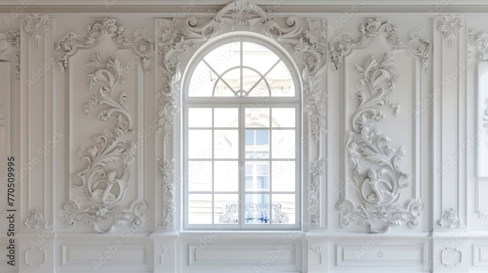 Ornate classical interior with large window and intricate stucco molding.