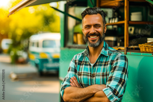 A casually dressed man exudes an air of easygoing confidence as he leans on a vintage-style food truck photo