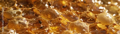 detailed macro shot of honeycomb cells filled to the brim with golden honey