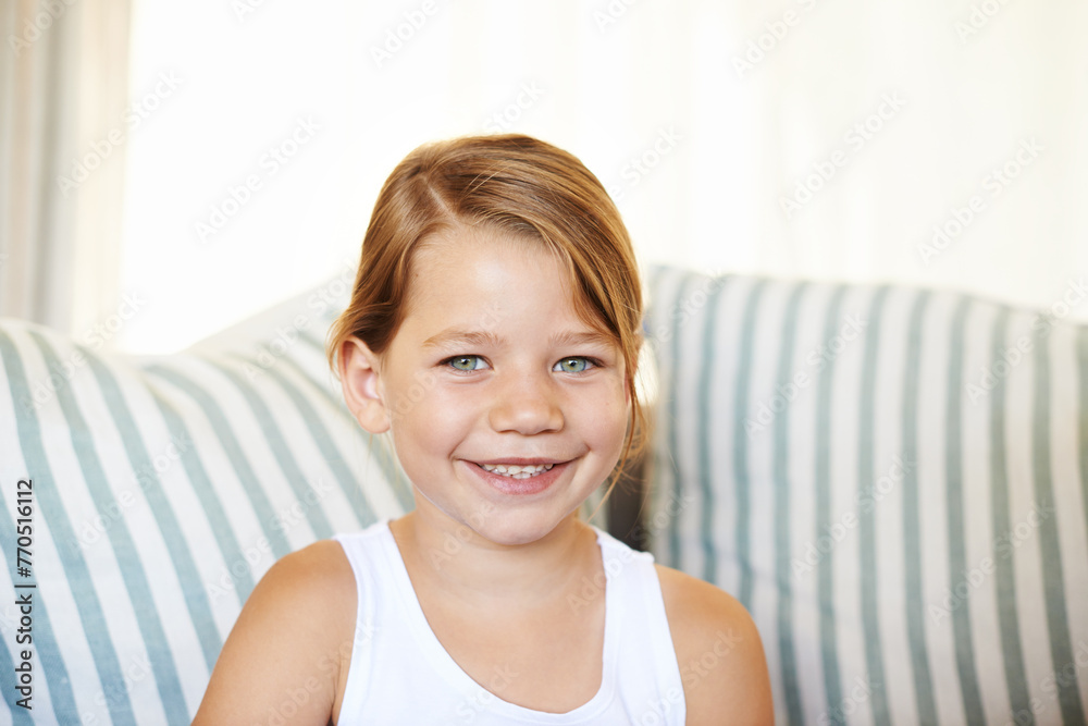Portrait, smile and girl child in home on sofa alone to relax in living room of apartment. Face, couch and adorable young kid in lounge, casual and positive with happiness in house in Switzerland Portrait, smile and girl child in home on sofa alone to relax in living room of apartment. Face, couch and adorable young kid in lounge, casual and positive with happiness in house in Switzerland