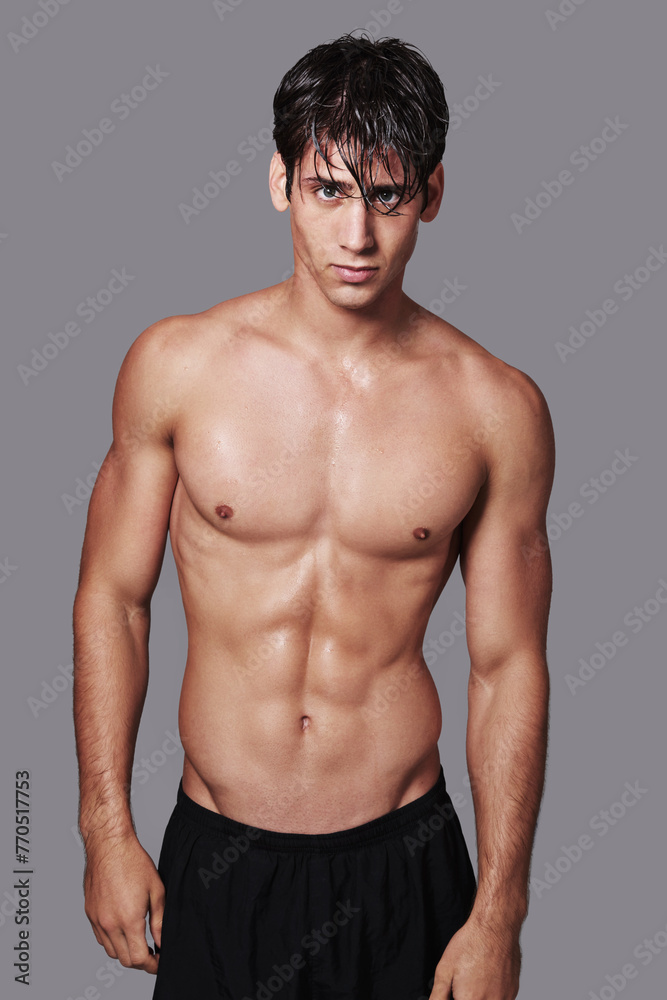 Man, portrait and muscle confidence in studio for workout routine with stomach abs, grey background or mockup space. Male person, face and model or healthy wellness for hygiene, cleaning or fitness Man, portrait and muscle confidence in studio for workout routine with stomach abs, grey background or mockup space. Male person, face and model or healthy wellness for hygiene, cleaning or fitness