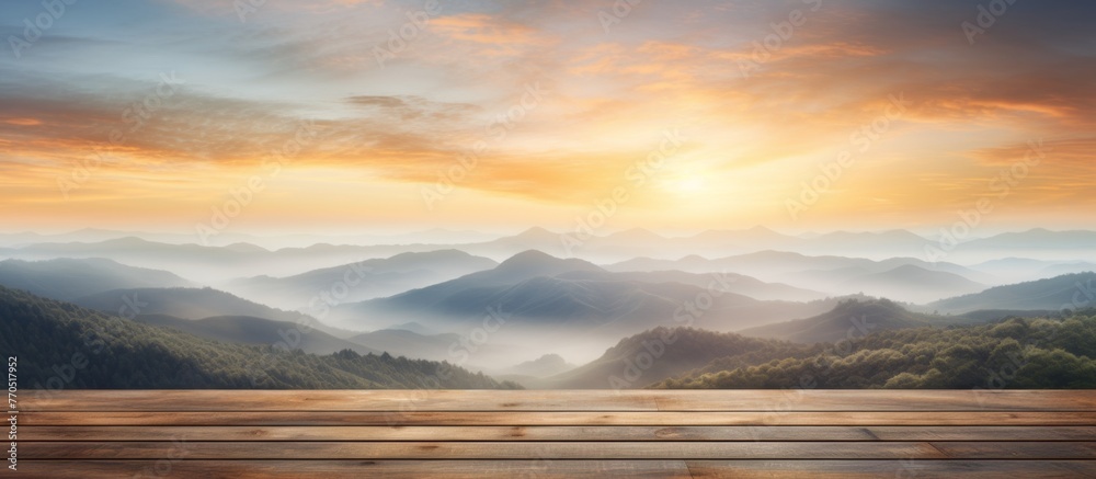Obraz premium A peaceful scene with a wooden table in the foreground and a beautiful sunset in the background, painting the sky with vibrant colors and creating a calming atmosphere