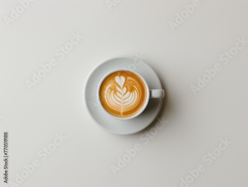 A top-down view of a flawless cappuccino with intricate latte art, served in a white cup on a saucer, ideal for menus, cafes, and coffee enthusiast content.
