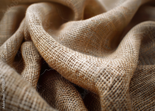 Texture of brown burlap textile, close up view. Crumpled sackcloth, an abstract background. Selective soft focus. Blurred background
 photo