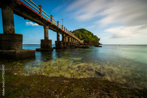 view of the long bridge beach in Malang Regency using the long exposure photo technique