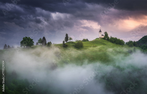 Jamnik church on top of the hill on a moody and stormy day