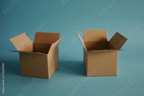 Two empty cardboard boxes open against a serene blue background.