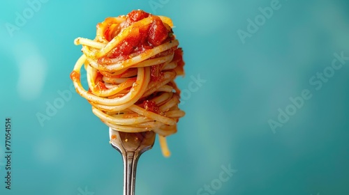 Spaghetti fork isolated on blue background. Pasta with tomato sauces. Italian food cooking. Tasty dinner at Italia restaurant. Delicious lunch delivery ad with copy space. Copyspace for text. Mock up