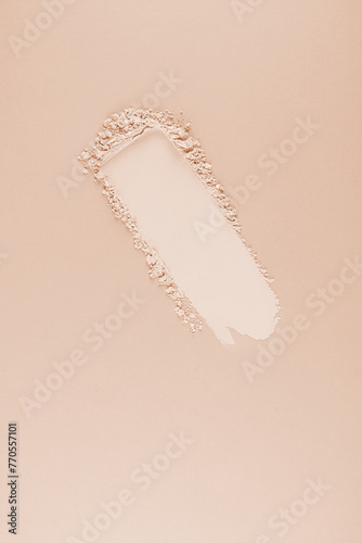 A beautiful swatch of natural loose powder for cosmetic facial skin care. Beige vertical background. A copy space. Blank layout. mockup.