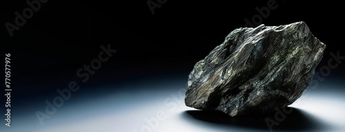 Berthierite is a rare precious natural stone on a black background. AI generated. Header banner mockup with space.