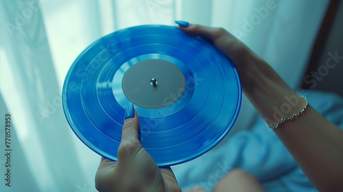 Female hands holding a vinyl record. Minimal retro party concept. Music festival concept.