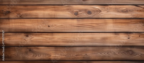 A detailed shot of a brown wooden wall with a blurred background, showcasing the intricate pattern of hardwood planks treated with wood stain