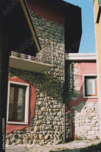 Historic Stone House in Endenna Mountain Village, Italian Alps, During a Sunny Day. Bergamo Province, Italy. Film Photography