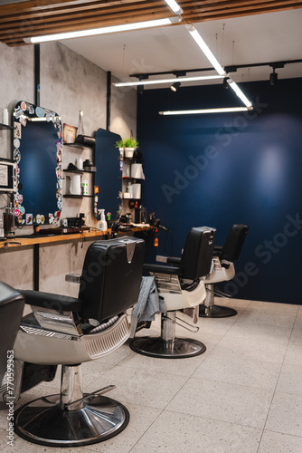 Workplace in a barbershop with chairs and a mirror