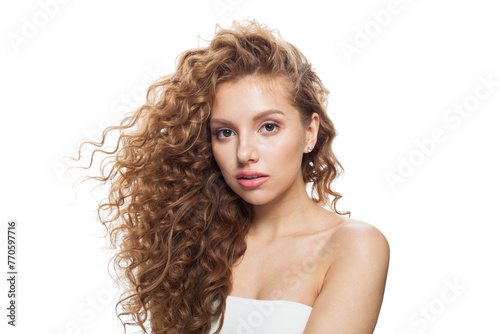Stylish woman face. Young model with healthy skin, long hair and makeup on white background