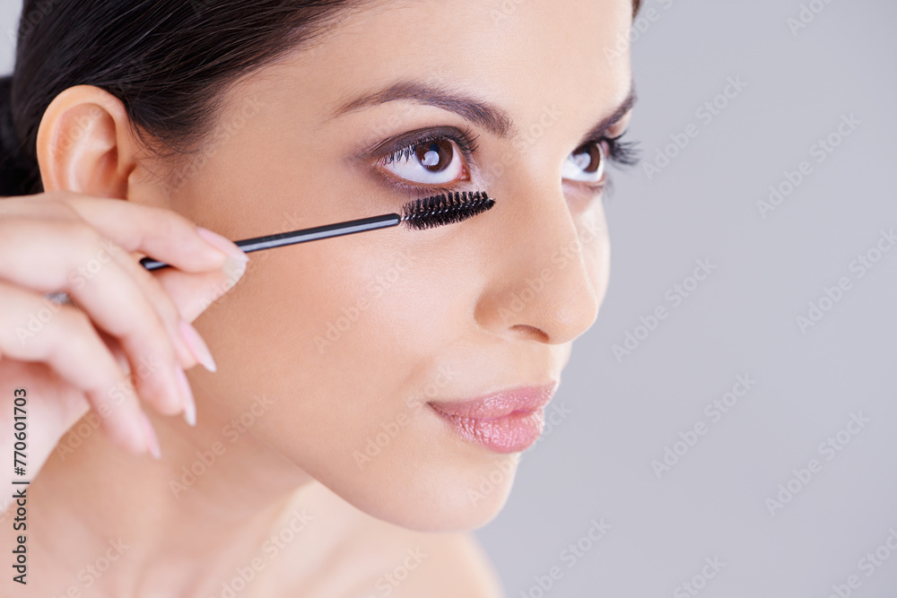 Beauty, mascara and brush for lashes with woman in studio, makeup and cosmetology on white background. Skin, glow and transformation for makeover, cosmetic product and wand for eyelash with volume Beauty, mascara and brush for lashes with woman in studio, makeup and cosmetology on white background. Skin, glow and transformation for makeover, cosmetic product and wand for eyelash with volume