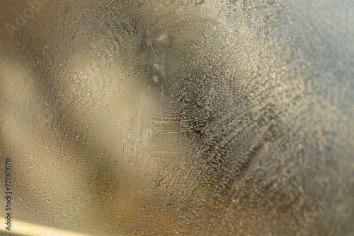 close shot of sandpaper on glass for frosted effect photo