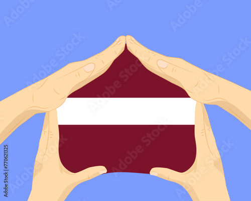 Hand home with Latvia flag, residential or investment idea, housing and home concept