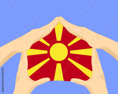 Hand home with Macedonia flag, residential or investment idea, housing and home concept