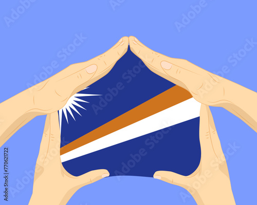Hand home with Marshall Islands flag, residential or investment idea, housing and home concept