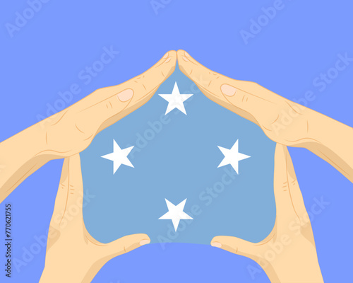 Hand home with Micronesia flag, residential or investment idea, housing and home concept