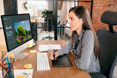 Graphic designer woman working in office