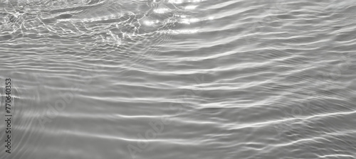 Closeup of desaturated transparent clear calm water surface texture with splashes and bubble. Generative AI.