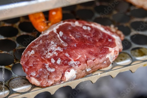 Close-up of a grilled rack of meat on a barbecue grill
