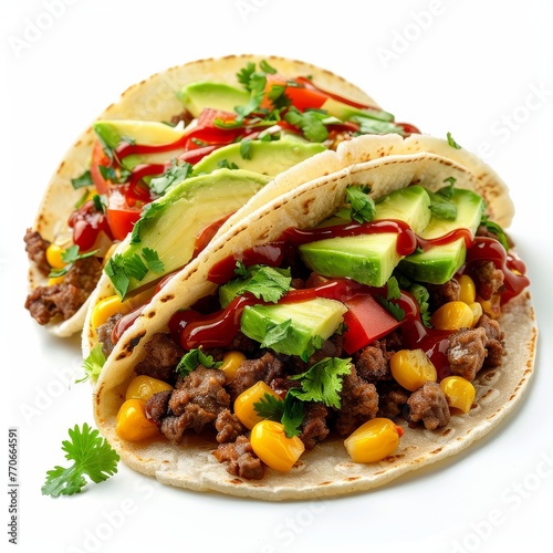 Two tacos filled with meat, corn, and avocado