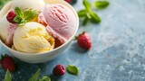 Assorted Scoops of Ice Cream with Fresh Mint and Raspberries in Bowl