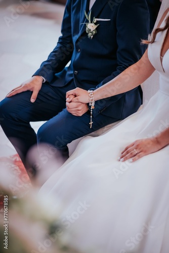 Bride and the groom in a church during their wedding ceremony photo