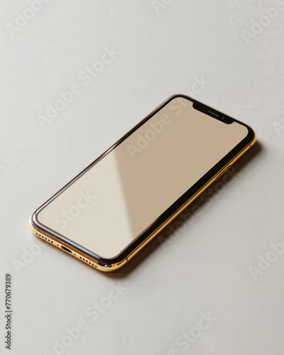 Minimalistic photo of a modern smartphone with elegant gold detailing laying on a smooth neutral-colored background photo