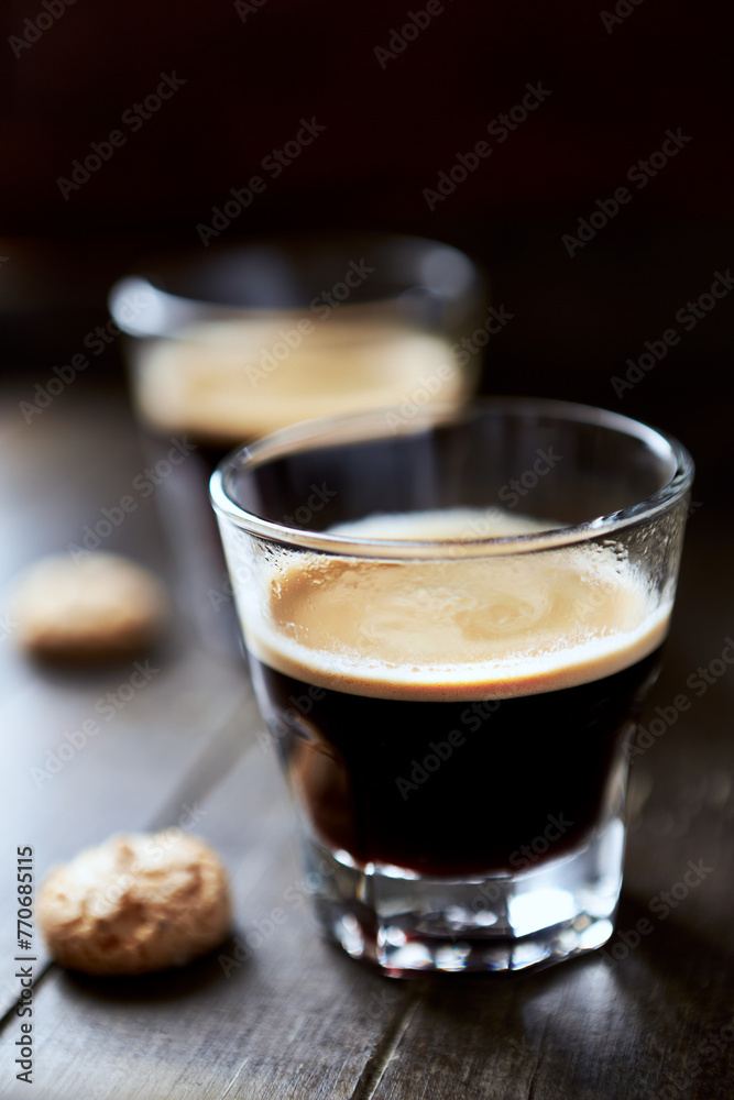 Two Glasses Of Coffee on dark wooden background. Close up. Two Glasses Of Coffee on dark wooden background. Close up.