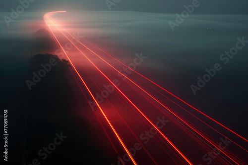 Lights traces left by fast moving vehicle at foggy night. Long exposure effect. Streaks of light. Abstract illustration of speed light and time