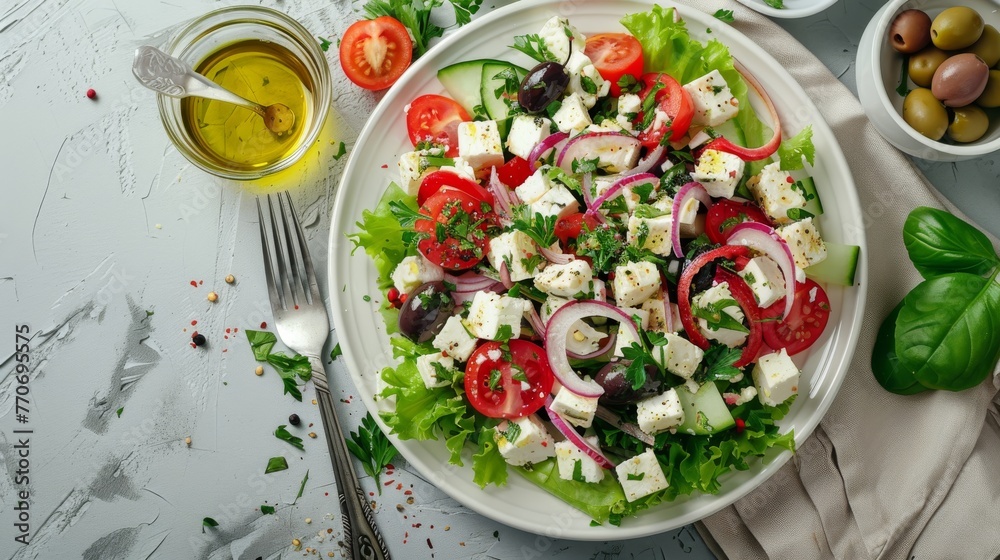 Fresh Greek salad with feta cheese, tomatoes, and olives on a white background Fresh Greek salad with feta cheese, tomatoes, and olives on a white background