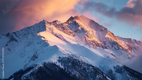 Sunrise Splendor: Light Cascading Over Snowy Peaks and Dense Forests in a Remote Mountain Range © AounMuhammad
