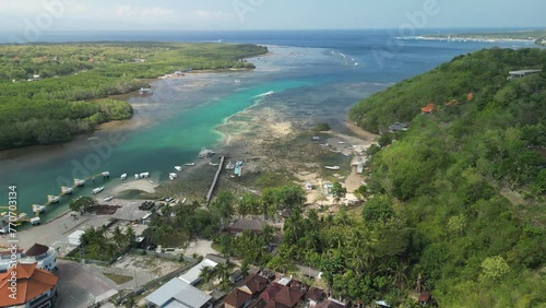 Drone footage of a tourism resort on Nusa Ceningan Island on a sunny day in Bali, Indonesia photo