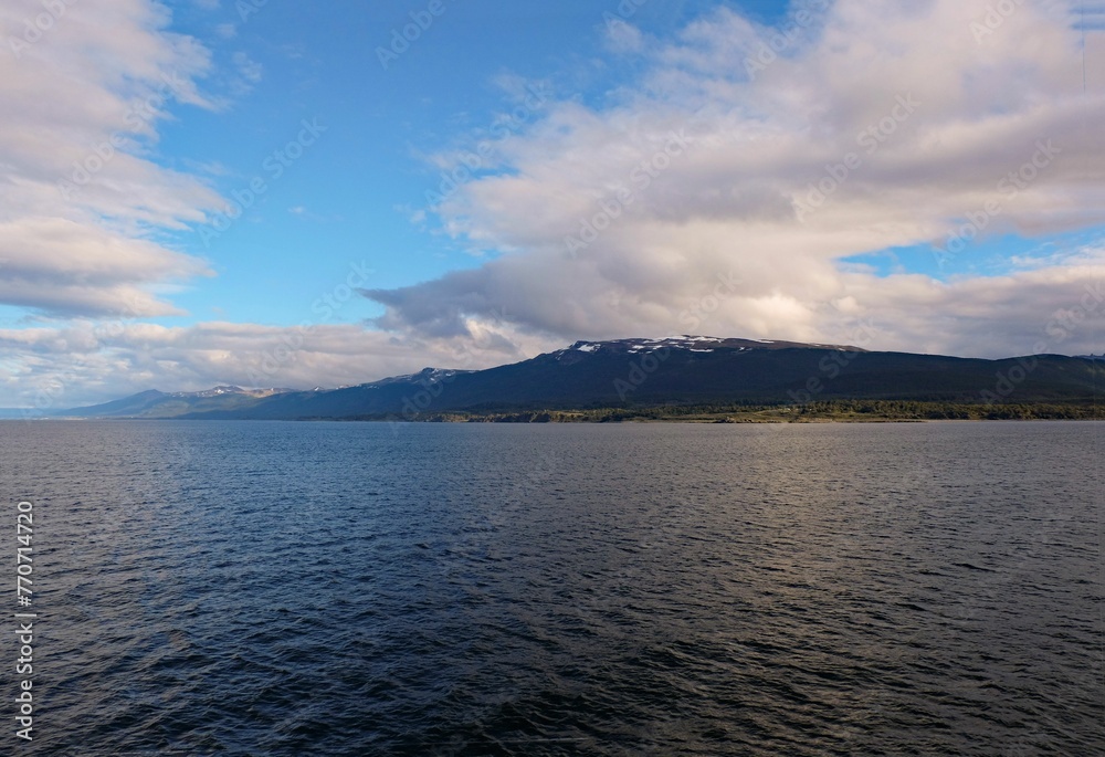 Stunning and peaceful scene of the Beagle channel with hills in the background