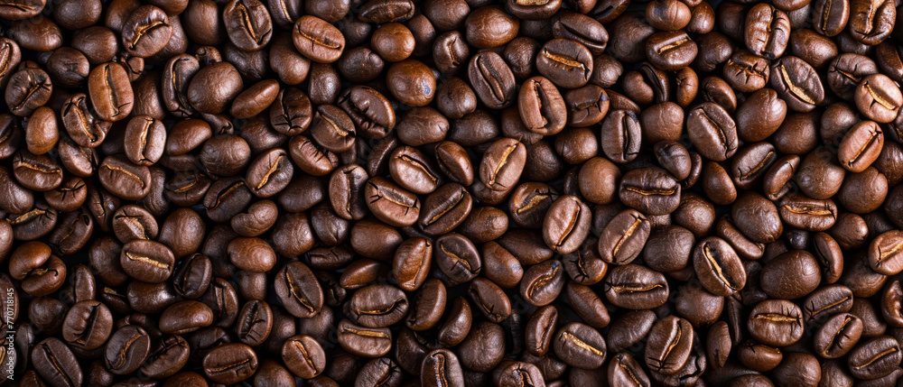 Roasted coffee beans, can be used as a background or design.