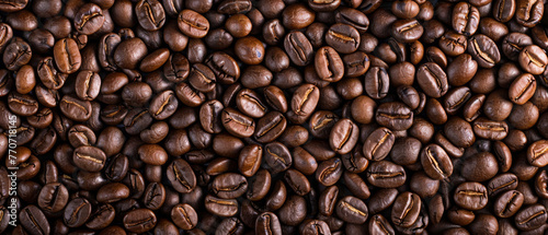 Roasted coffee beans, can be used as a background or design.