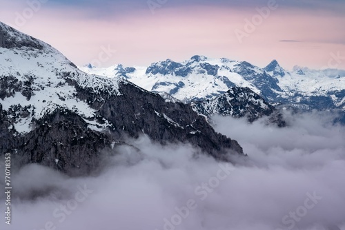 Scenic landscape with majestic mountain peaks, a vibrant sky, and fluffy clouds in Berchtesgaden
