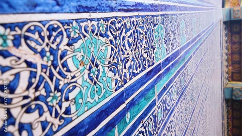 Vertical video footage of close-up of majolica panels on the walls traditionally blue-white-blue coloured. The beautiful Tash-Khovli Palace in the ancient city of Ichan-Kala, Khiva, Uzbekistan photo