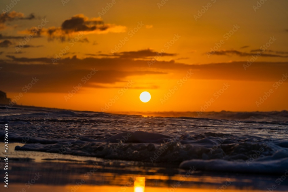 Beautiful seascape featuring a stunning sunset on the beach in Destin, Florida. Beautiful seascape featuring a stunning sunset on the beach in Destin, Florida.