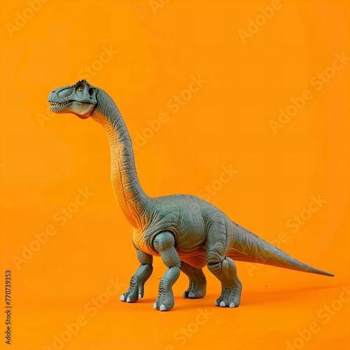 Realistic Toy Dinosaur Model Orange Background © kilimanjaro 